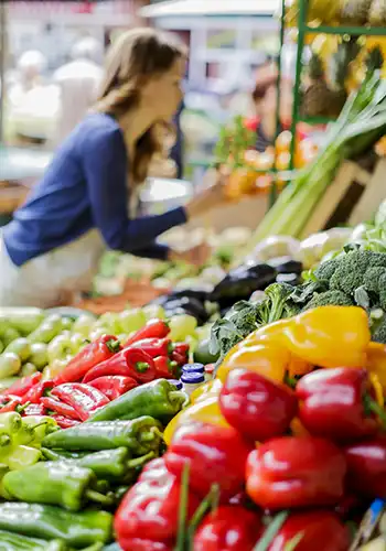 Farmer sharing local food with consumers at a market