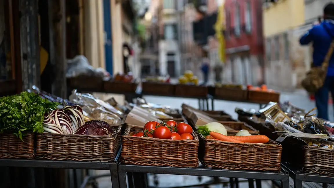 Local producer selling fresh food at a farmers market